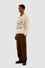 Pull en maille avec logo en fleuri